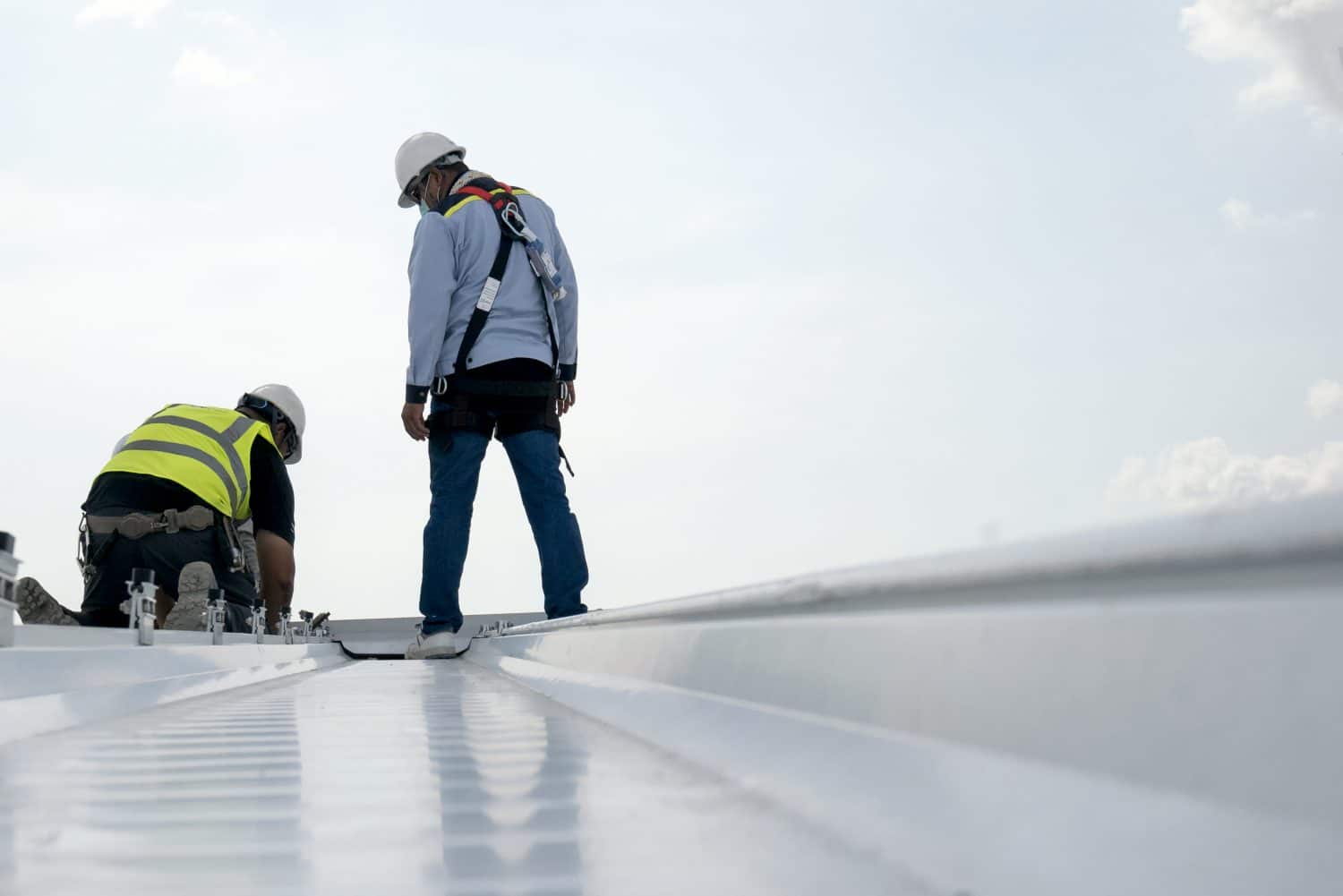 two men doing industrial and commercial factory roofing